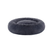Pluizig hondenbed in de vorm van een donut