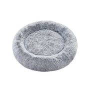 Pluizig hondenbed in de vorm van een donut
