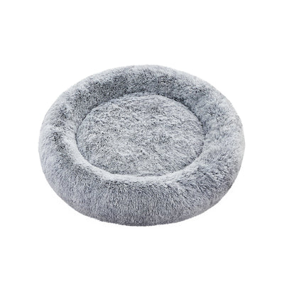 Pluizig hondenbed in de vorm van een donut