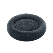 Pluizig hondenbed in de vorm van een donut