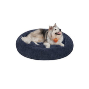 Pluizig hondenbed in de vorm van een donut